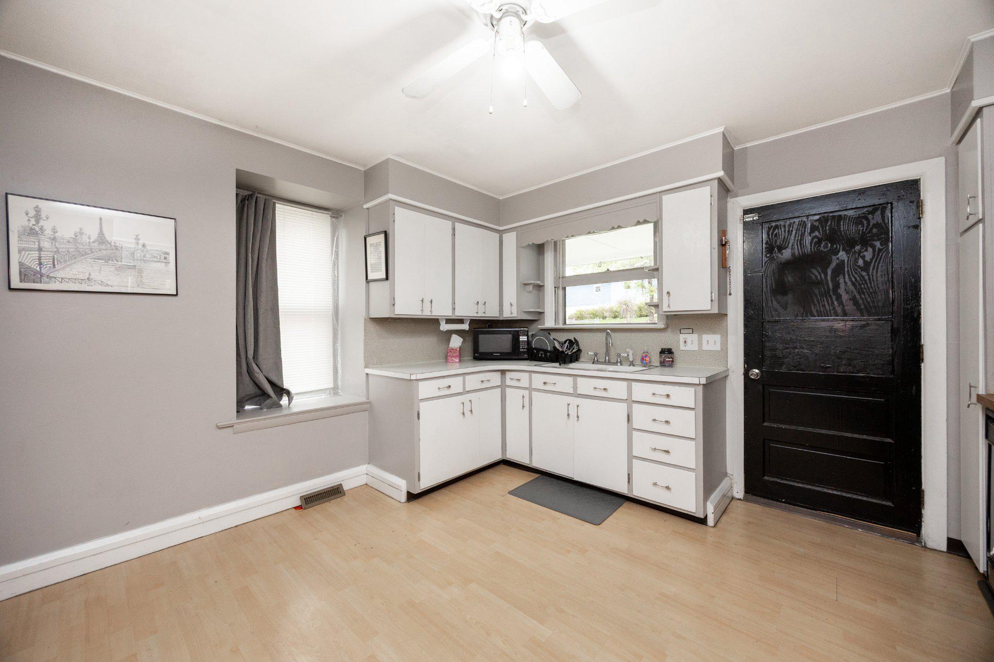 314 New Street Spring City, PA 19475 - Photo 6 of 16 a kitchen with granite countertop white cabinets and window