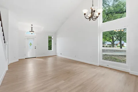 a kitchen with stainless steel appliances granite countertop wooden cabinets stove top oven and sink