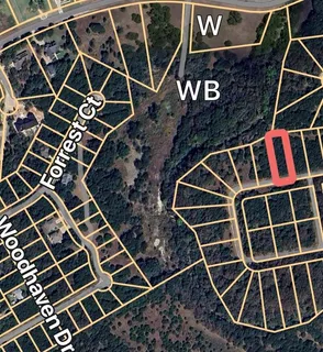 a front view of a building with garden