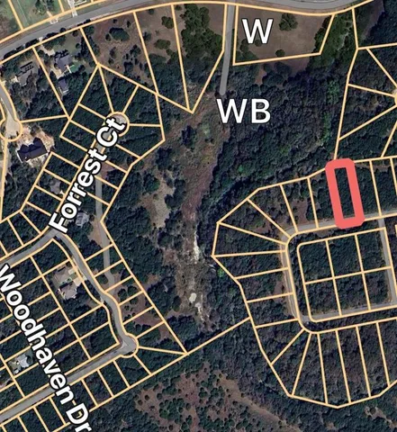 a front view of a building with garden