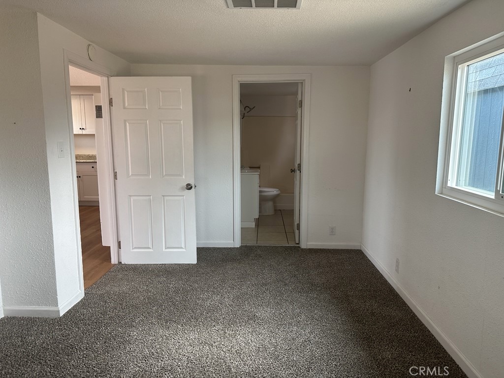 34929 Cedar Road Barstow, CA 92311 - Photo 14 of 22 an empty room with windows