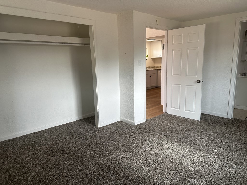 34929 Cedar Road Barstow, CA 92311 - Photo 16 of 22 a view of an empty room with closet and a window