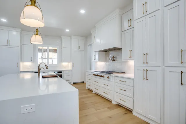 a dining room with chandelier and window