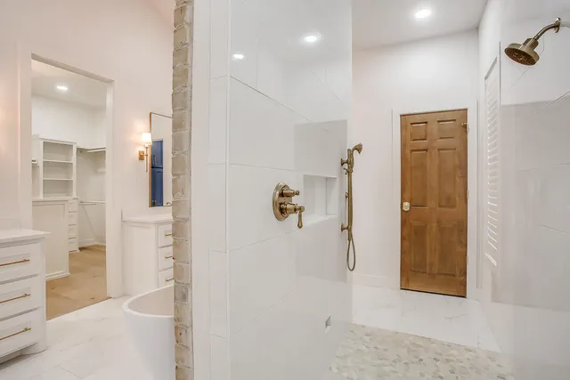 a bathroom with a sink a mirror and a bathtub