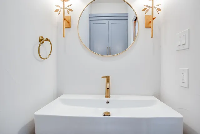 a view of staircase with white walls and a window