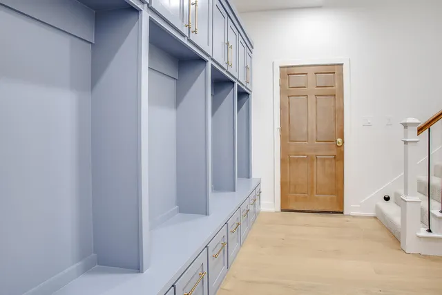 an empty room with a empty space and windows