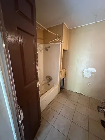 a bathroom with a shower and a toilet