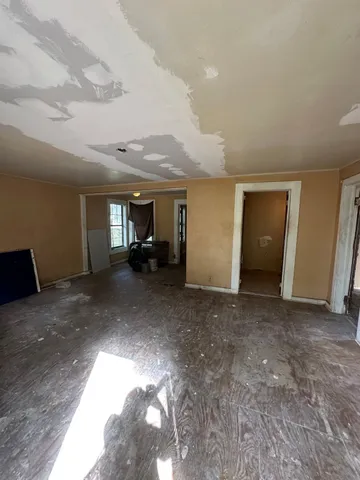 a view of a livingroom with furniture and a stove