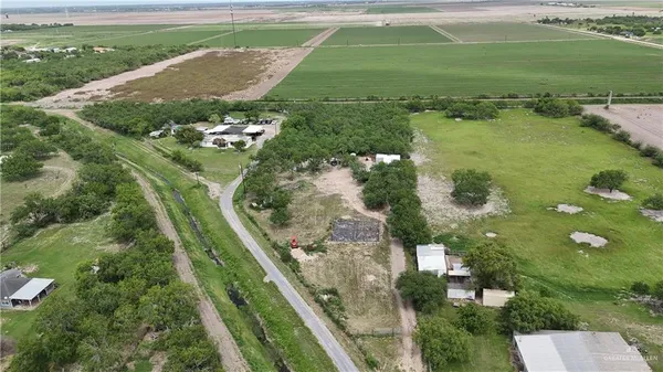 an aerial view of a houses with outdoor space