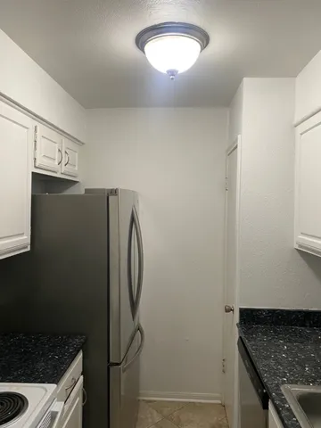 a view of a storage and utility room in a kitchen