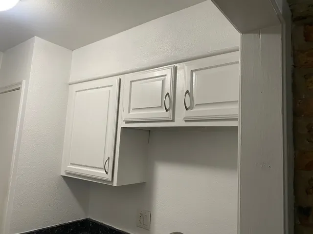 a room with a bed and a window