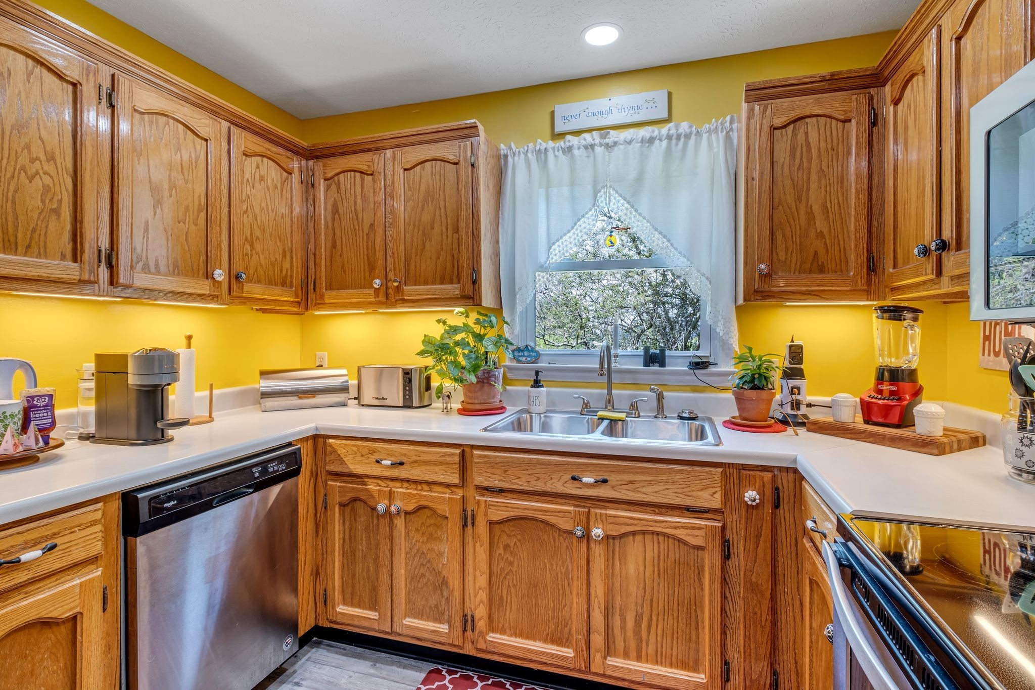 3526 Horn Springs Road Lebanon, TN 37087 - Photo 12 of 41 a kitchen with stainless steel appliances a sink a stove and a wooden cabinets