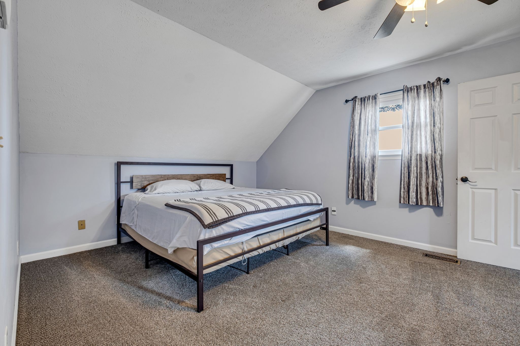 3526 Horn Springs Road Lebanon, TN 37087 - Photo 22 of 41 a bed sitting in a spacious bedroom next to a window