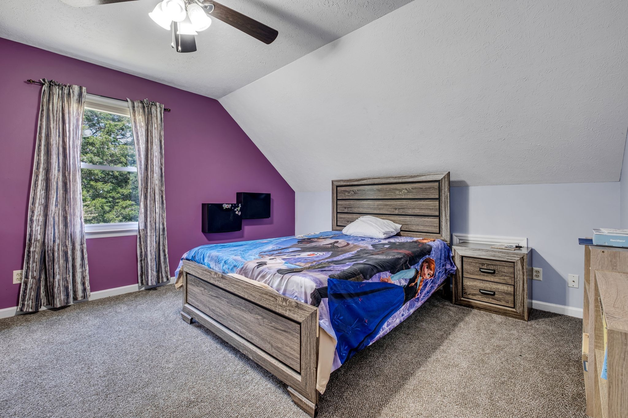 3526 Horn Springs Road Lebanon, TN 37087 - Photo 26 of 41 a bed sitting in a bedroom next to a window and a chandelier
