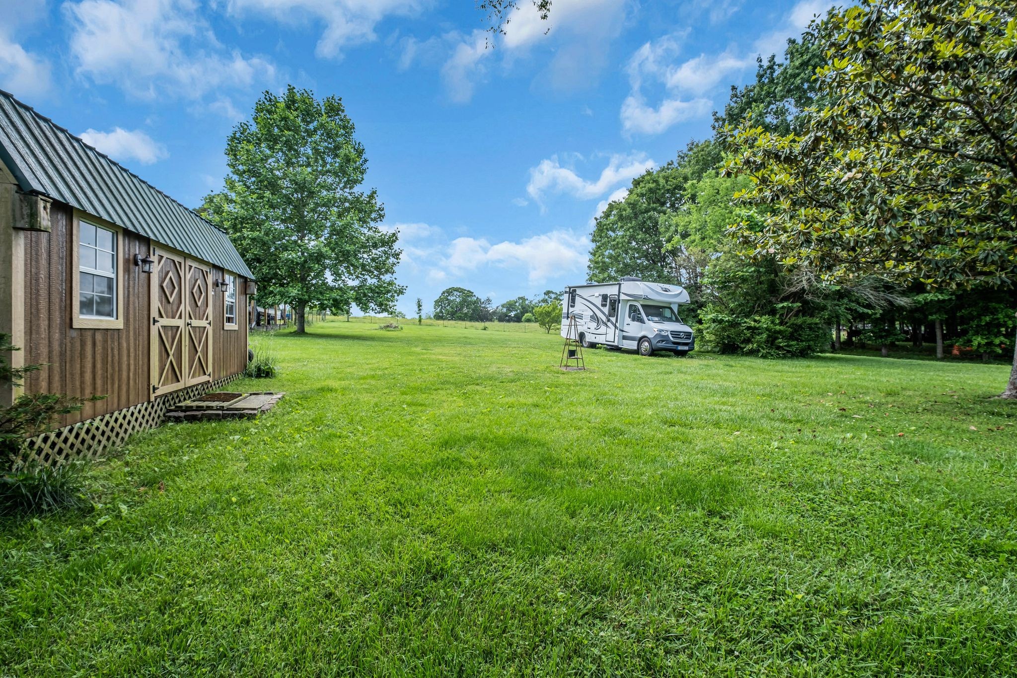3526 Horn Springs Road Lebanon, TN 37087 - Photo 29 of 41 a view of a house with a big yard and large trees