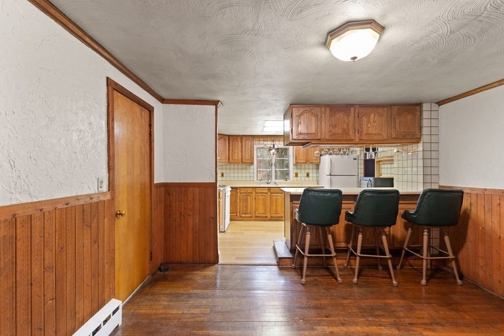 119 River Street Middleton, MA 01949 - Photo 16 of 31 a dining room with furniture window and wooden floor