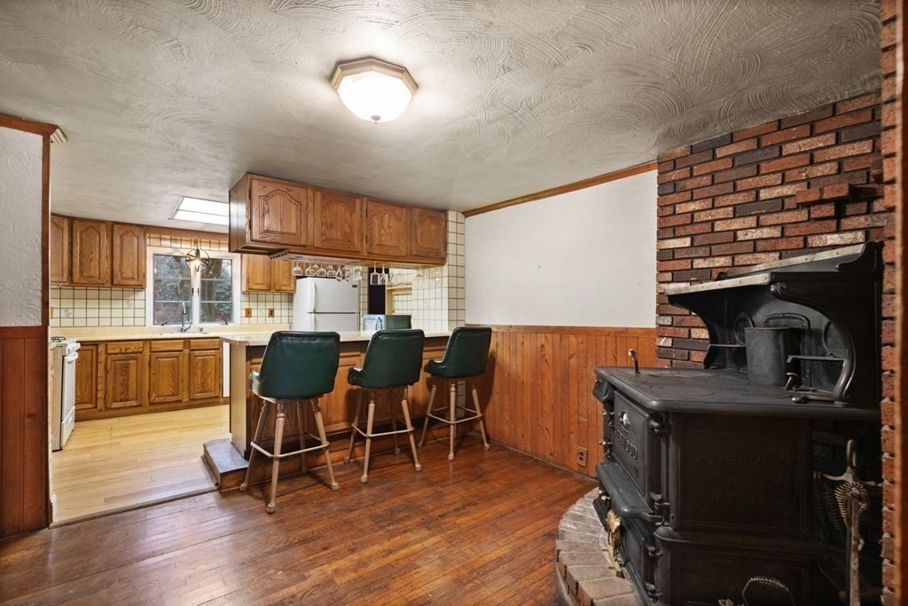 119 River Street Middleton, MA 01949 - Photo 17 of 31 a dining room with furniture and wooden floor
