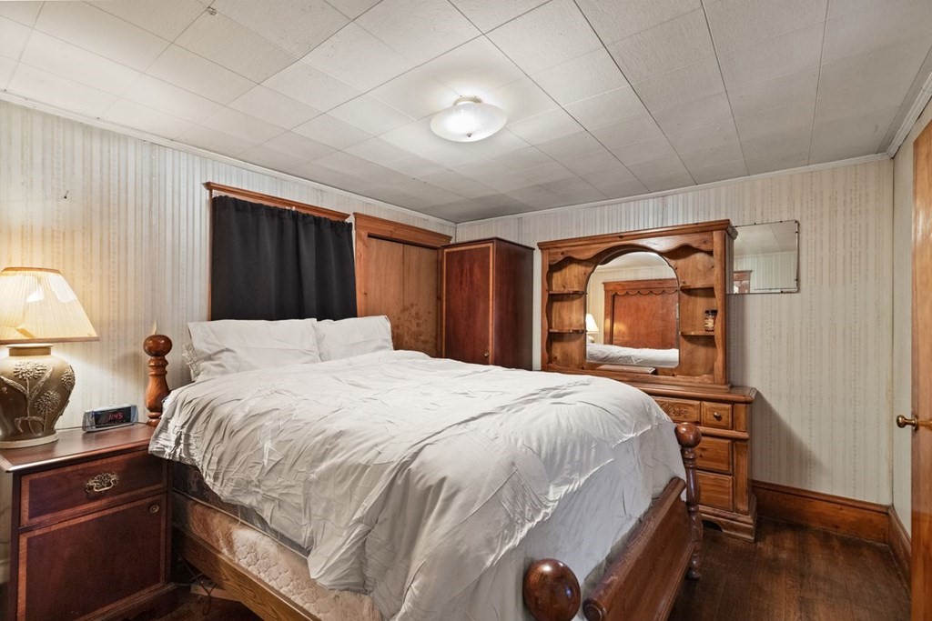119 River Street Middleton, MA 01949 - Photo 23 of 31 a bedroom with a bed and a dresser