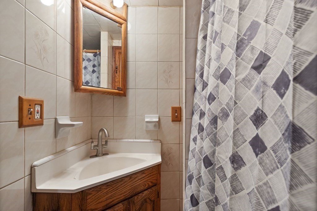 119 River Street Middleton, MA 01949 - Photo 27 of 31 a bathroom with a sink and a mirror