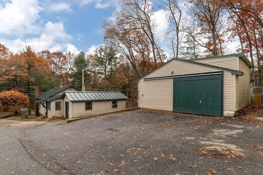 119 River Street Middleton, MA 01949 - Photo 4 of 31 a house with trees in the background