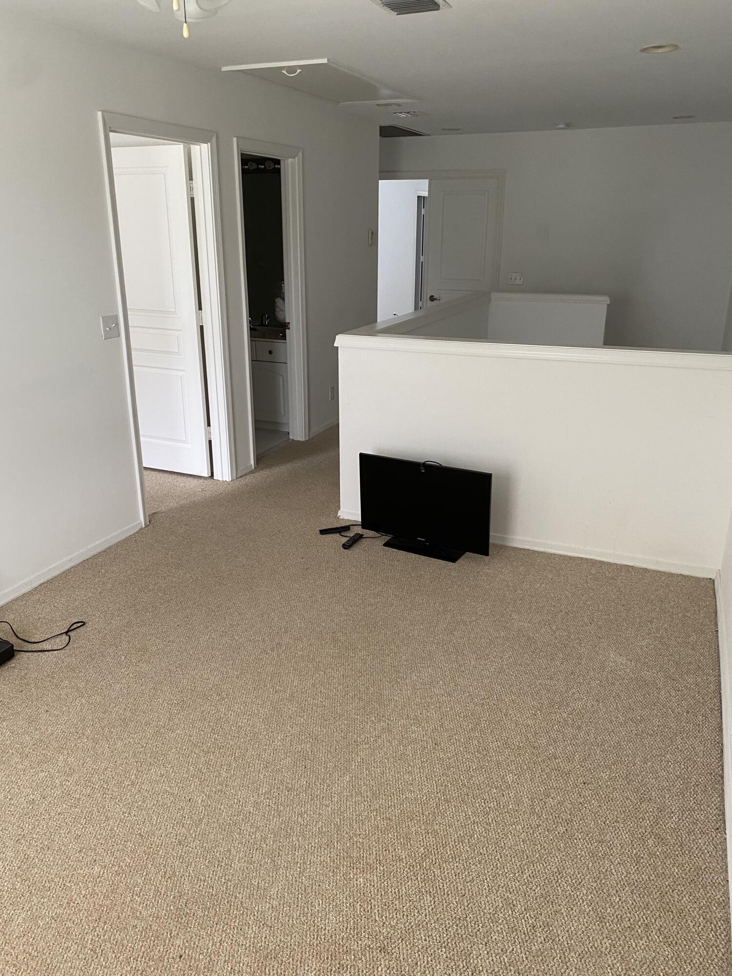 21530 St Andrews Grand Circle, Unit 27 Boca Raton, FL 33486 - Photo 16 of 18 a room with closet