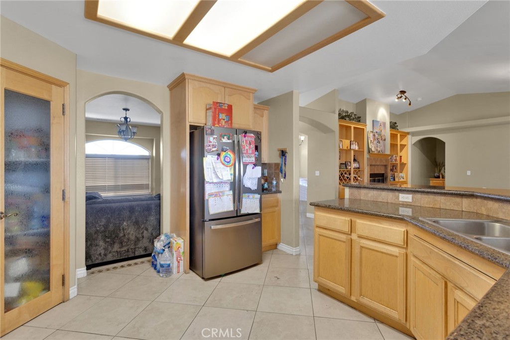 13597 Kiowa Road Apple Valley, CA 92308 - Photo 13 of 44 a spacious bathroom with a granite countertop sink a mirror and shower