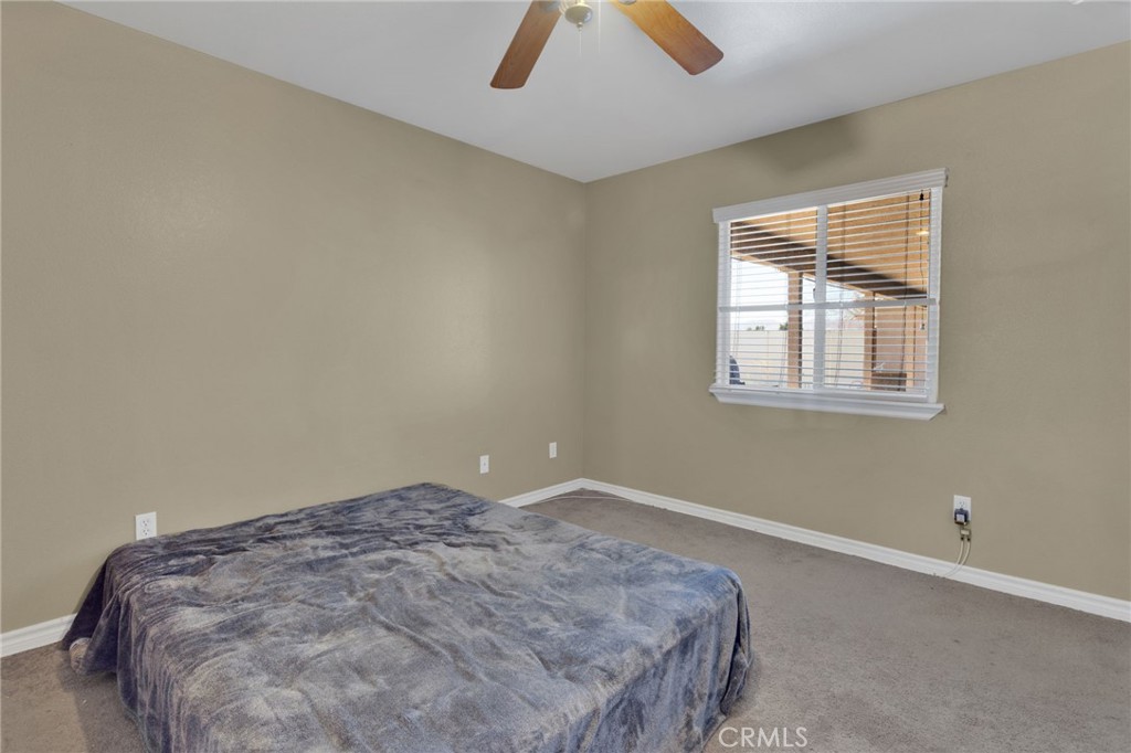 13597 Kiowa Road Apple Valley, CA 92308 - Photo 23 of 44 an empty room with windows