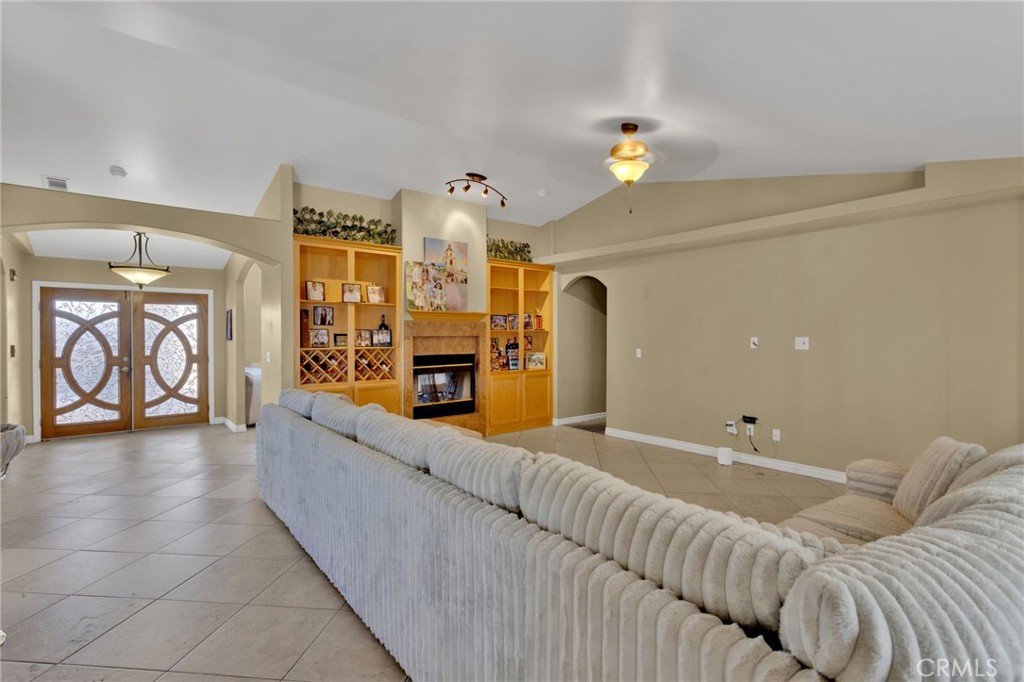 13597 Kiowa Road Apple Valley, CA 92308 - Photo 27 of 44 a living room with furniture and chandelier