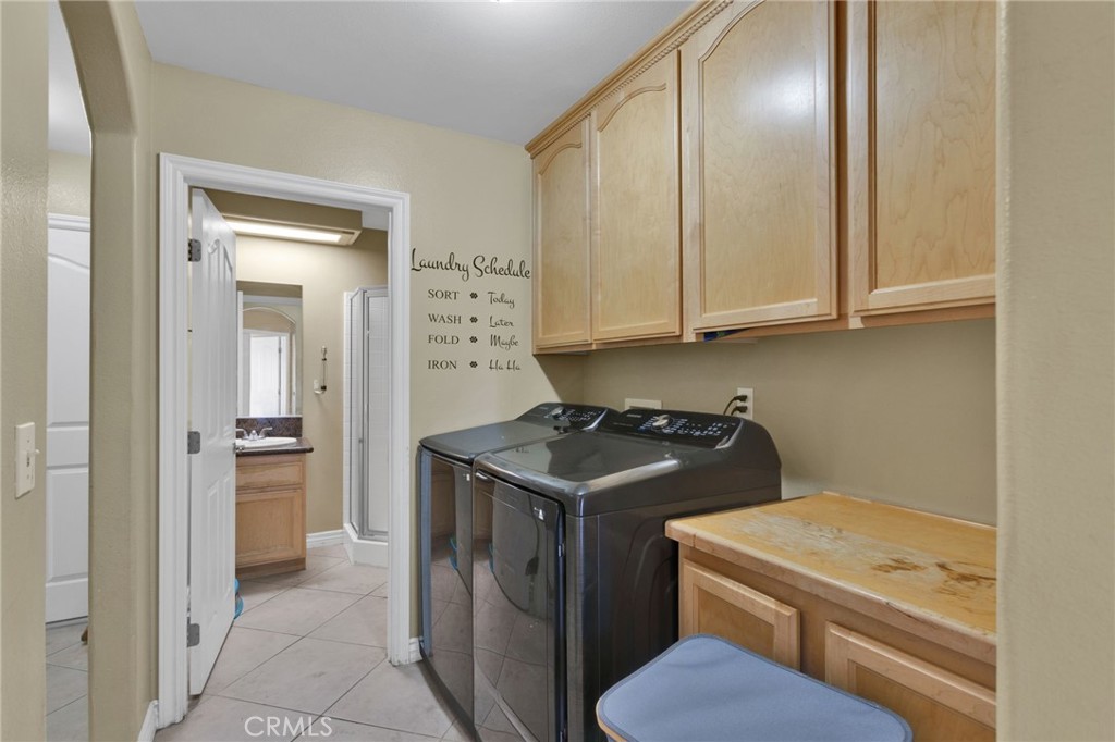 13597 Kiowa Road Apple Valley, CA 92308 - Photo 30 of 44 a kitchen with a stove and a refrigerator