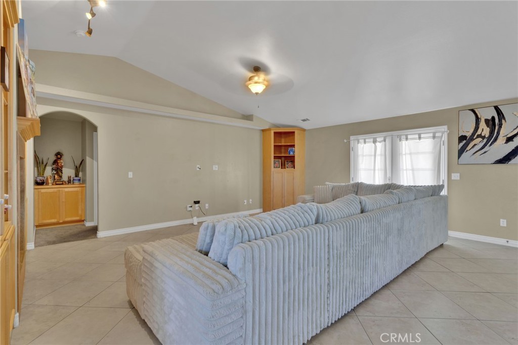 13597 Kiowa Road Apple Valley, CA 92308 - Photo 34 of 44 a living room with furniture and a window