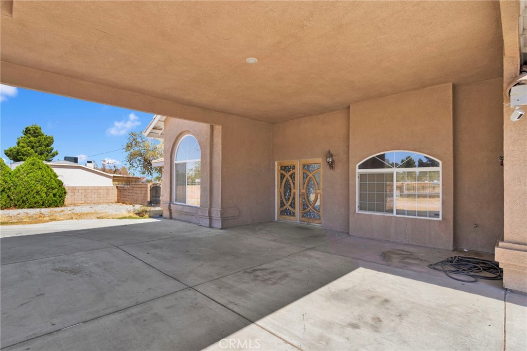 13597 Kiowa Road Apple Valley, CA 92308 - Photo 10 of 44 a view of a livingroom with a staircase