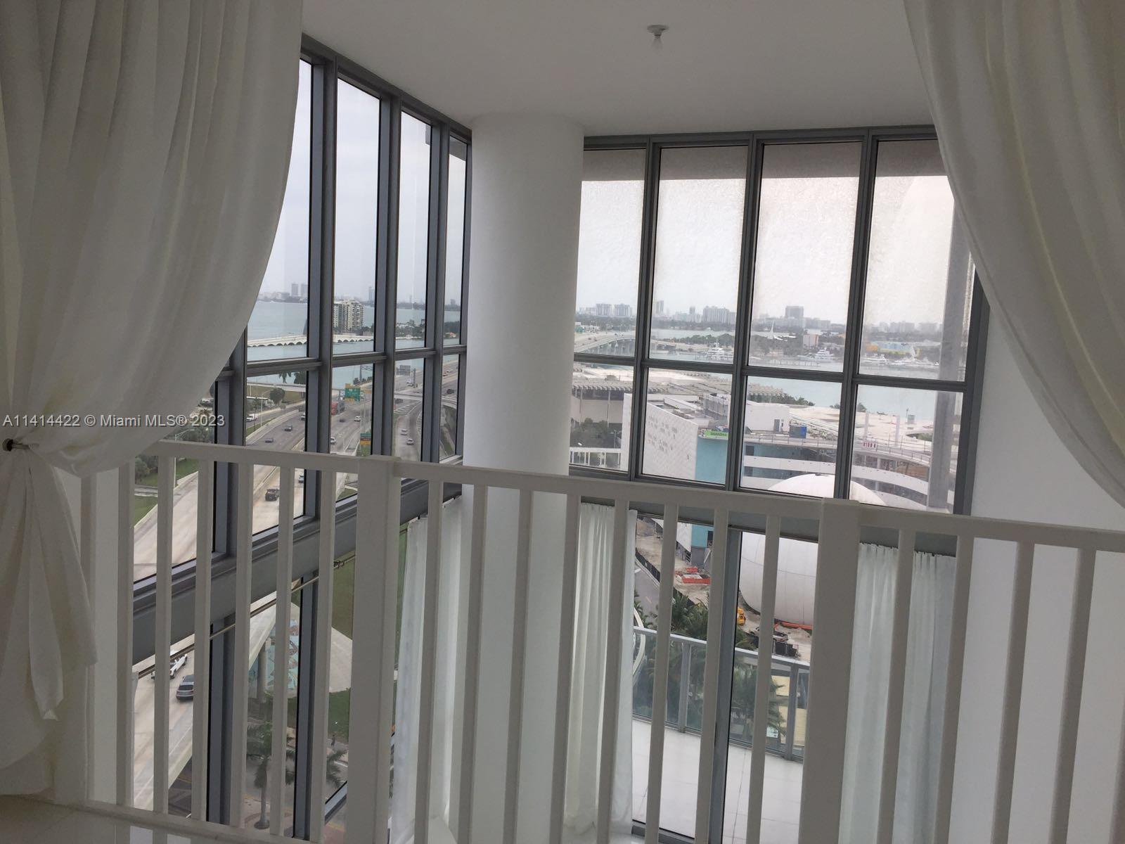 1100 Biscayne Boulevard, Unit 1505 Miami, FL 33132 - Photo 13 of 15 a view of staircase with large window