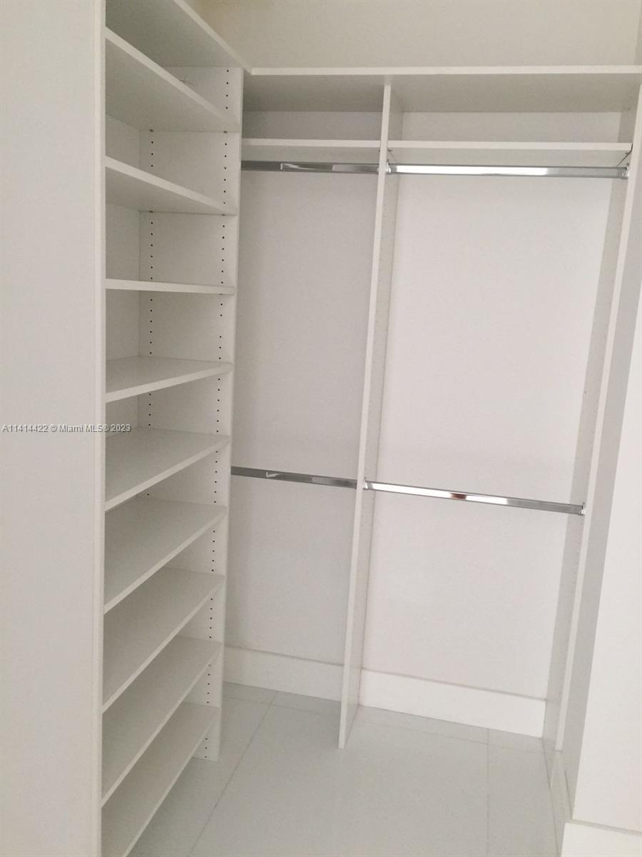 1100 Biscayne Boulevard, Unit 1505 Miami, FL 33132 - Photo 15 of 15 a view of an empty walk in closet