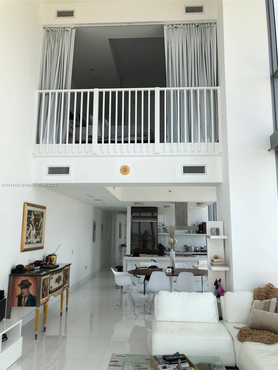 1100 Biscayne Boulevard, Unit 1505 Miami, FL 33132 - Photo 8 of 15 a living room with furniture