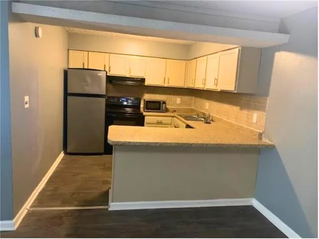 a bathroom with a sink and a shower