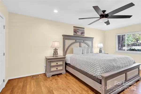 a bedroom with a bed and window