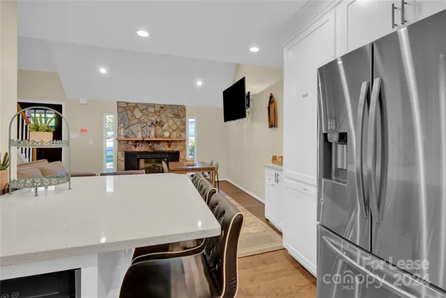 a kitchen with stainless steel appliances a refrigerator and a stove