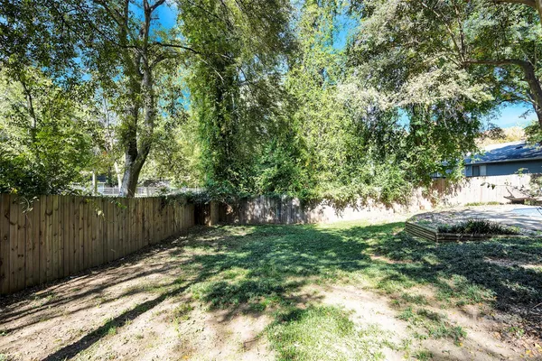 a backyard of a house with lots of green space