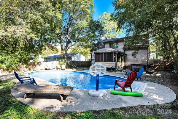 a view of house with outdoor seating area