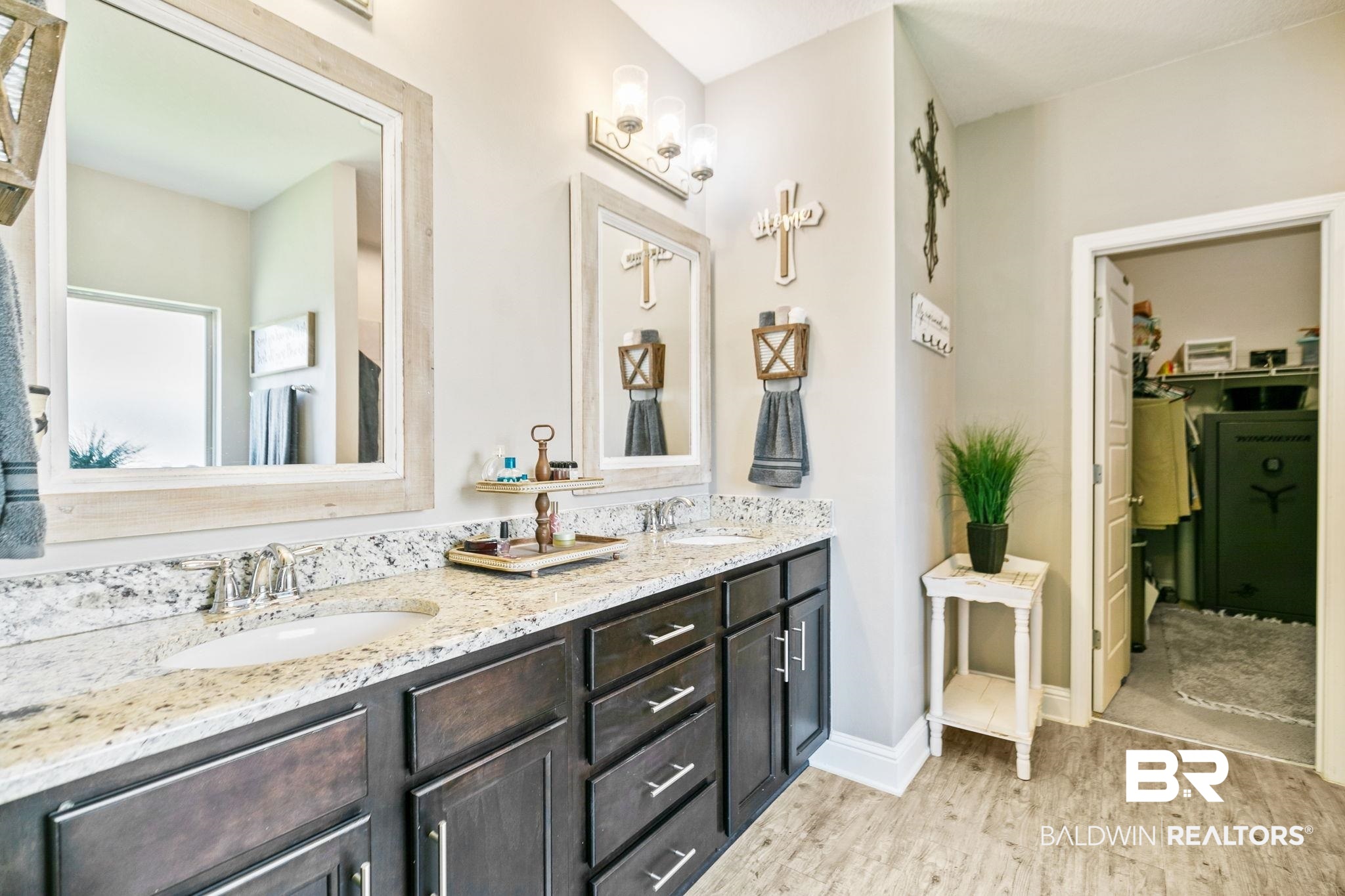 31402 Hoot Owl Road Daphne, AL 36527 - Photo 15 of 43 Bathroom with hardwood / wood-style flooring and dual bowl vanity