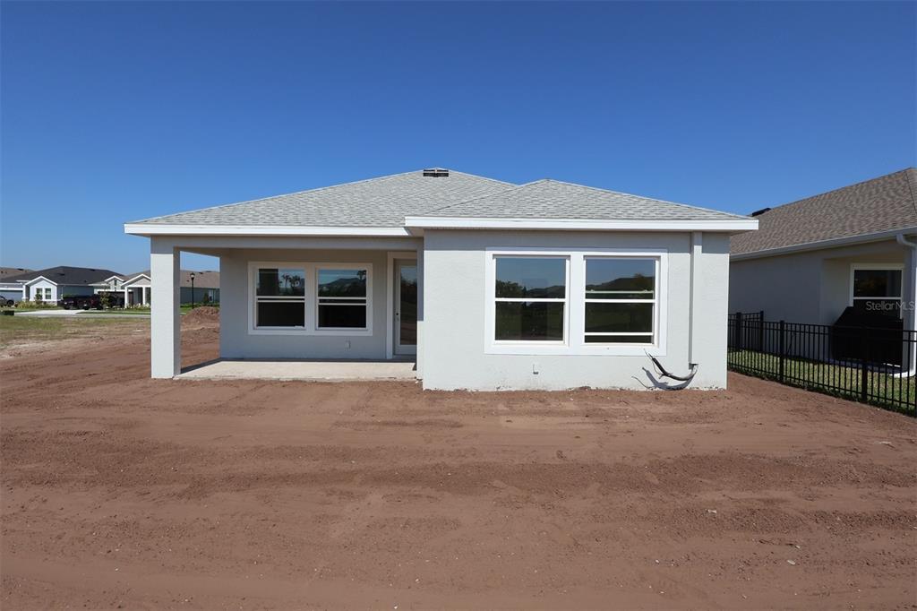 5113 Chapel Row Avenue Apollo Beach, FL 33572 - Photo 13 of 19 a house with trees in the background