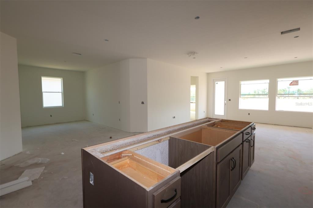 5113 Chapel Row Avenue Apollo Beach, FL 33572 - Photo 7 of 19 a kitchen that has a sink and a stove