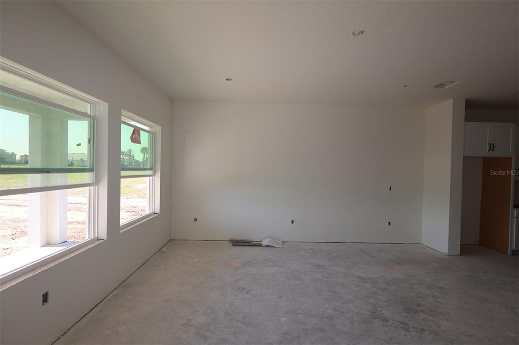 5113 Chapel Row Avenue Apollo Beach, FL 33572 - Photo 9 of 19 an empty room with windows