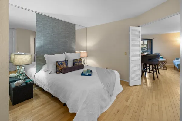 a bedroom with a bed and a table in it