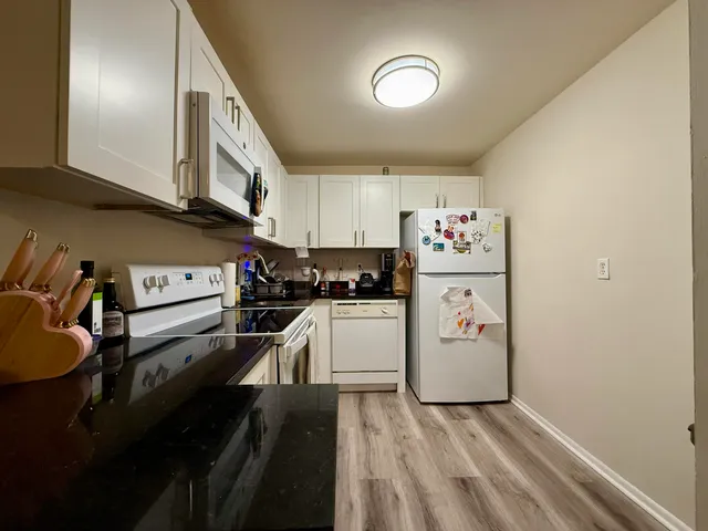 a bed room with a bed and a television