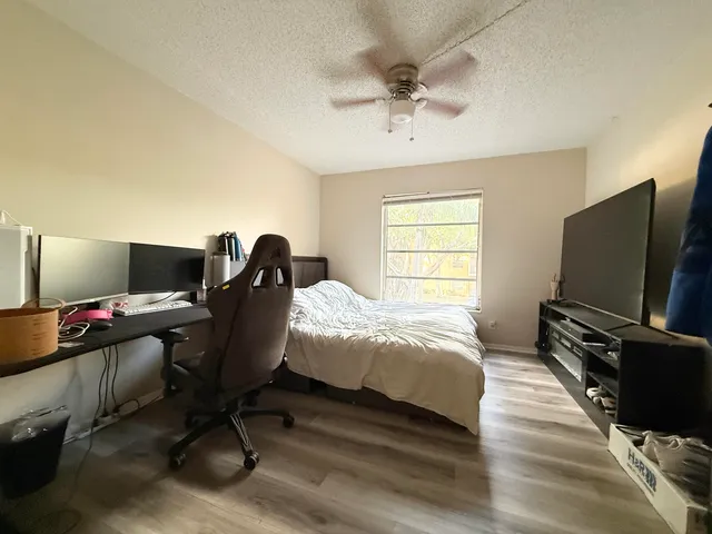 a bedroom with a workspace