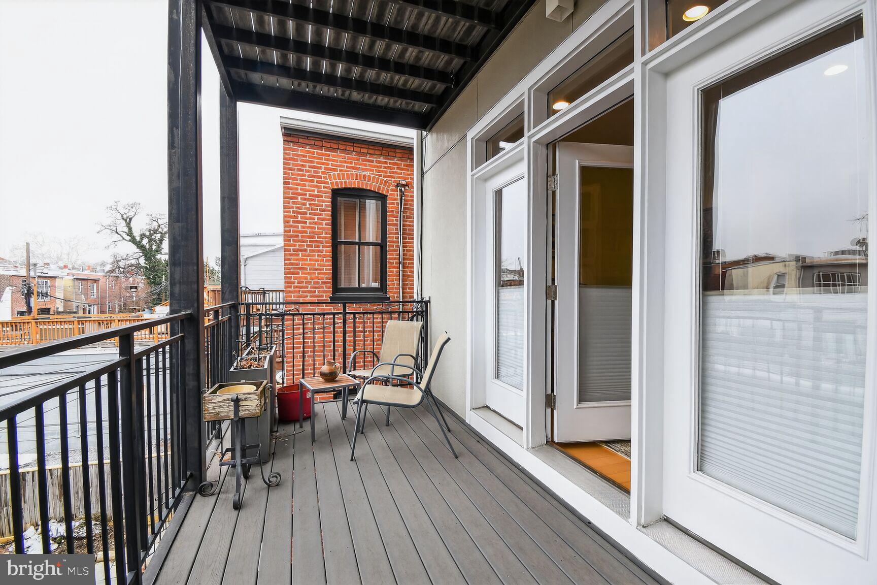912 S Street Northwest, Unit 1 Washington, DC 20001 - Photo 20 of 29 a view of balcony with chairs and wooden floor