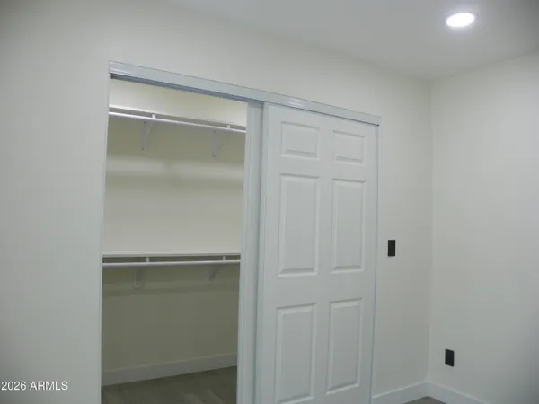 a view of a kitchen with a table and chairs
