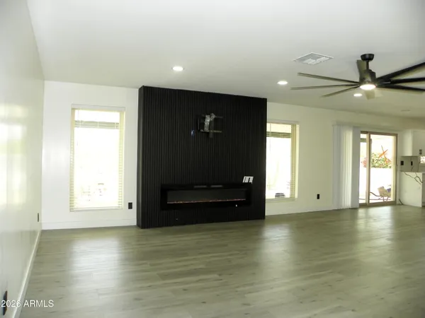 a view of living room with furniture and floor to ceiling window