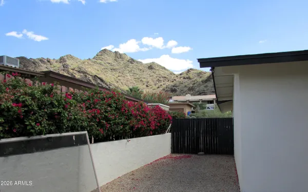 a view of a house with a flower garden